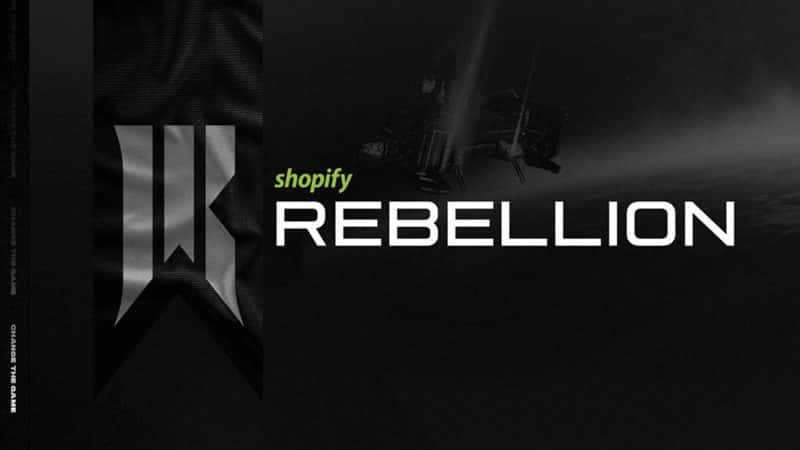 The words "Shopify Rebellion" appear against a black and white sky. A stylized R appears on an unfurled flag in the left of the frame